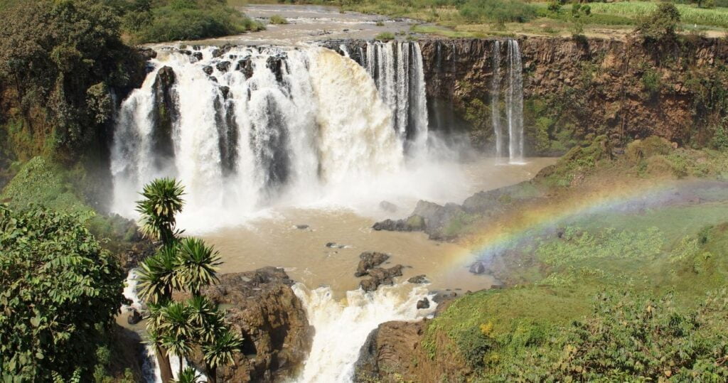 a rainbow over blue nile falls in africa